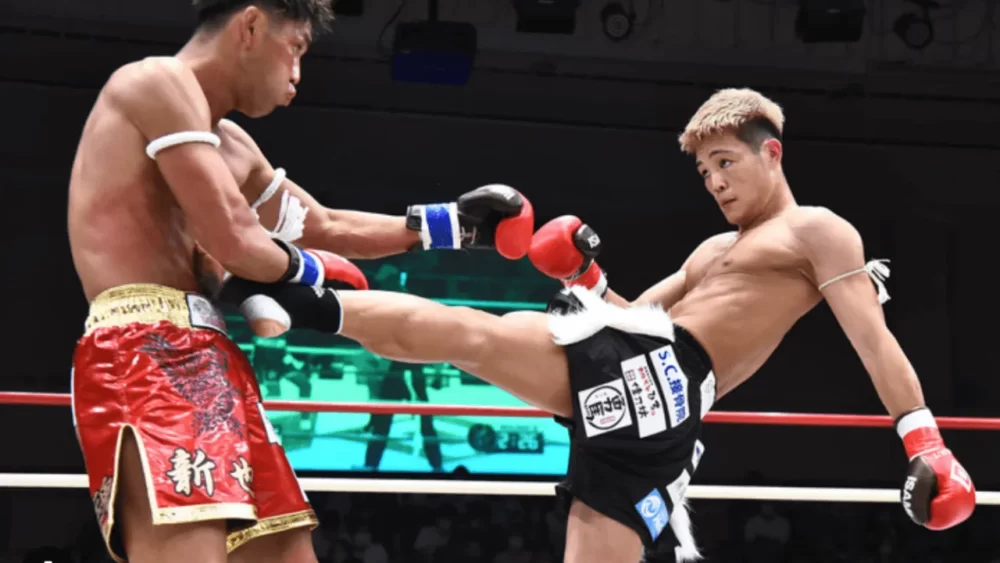 Image-of-a-man-delivering-a-front-kick-to-the-abdomen-of-his-opponent-in-a-martial-arts-match